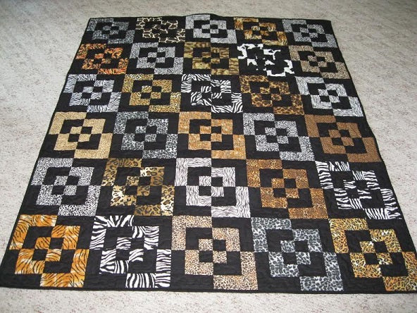 2 animal print and 2 solid black make a 60" x 72" Bento Box quilt! (Tutorial at bentoboxtutorial.com)